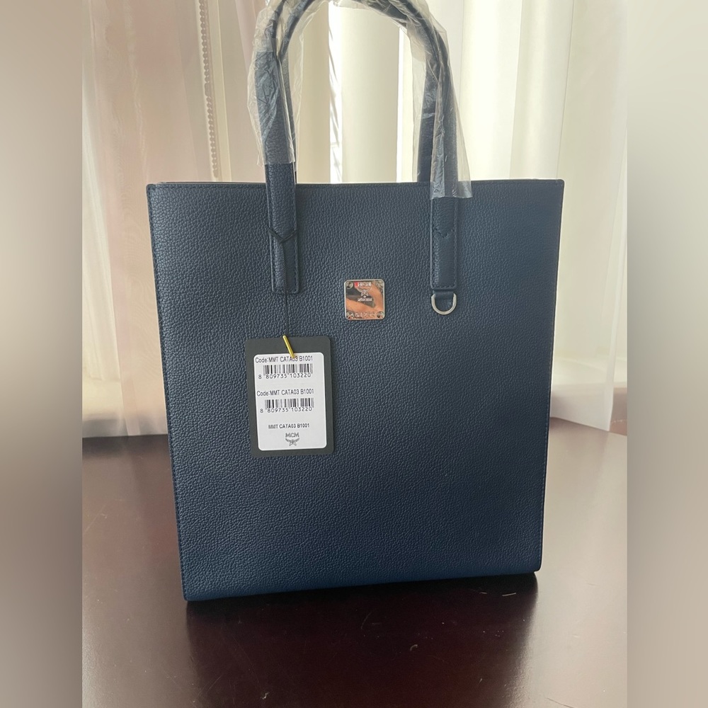 MCM mini top handle navy blue bag.